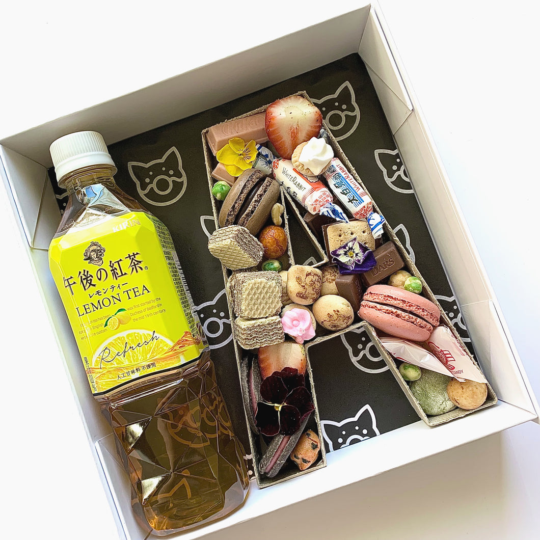 Dessert grazing boxes. Asian snack box. Personalised gifts. Featuring Asian & Japanese snacks, Meiji, macarons, mochi & lemon tea. Next day delivery Sydney.